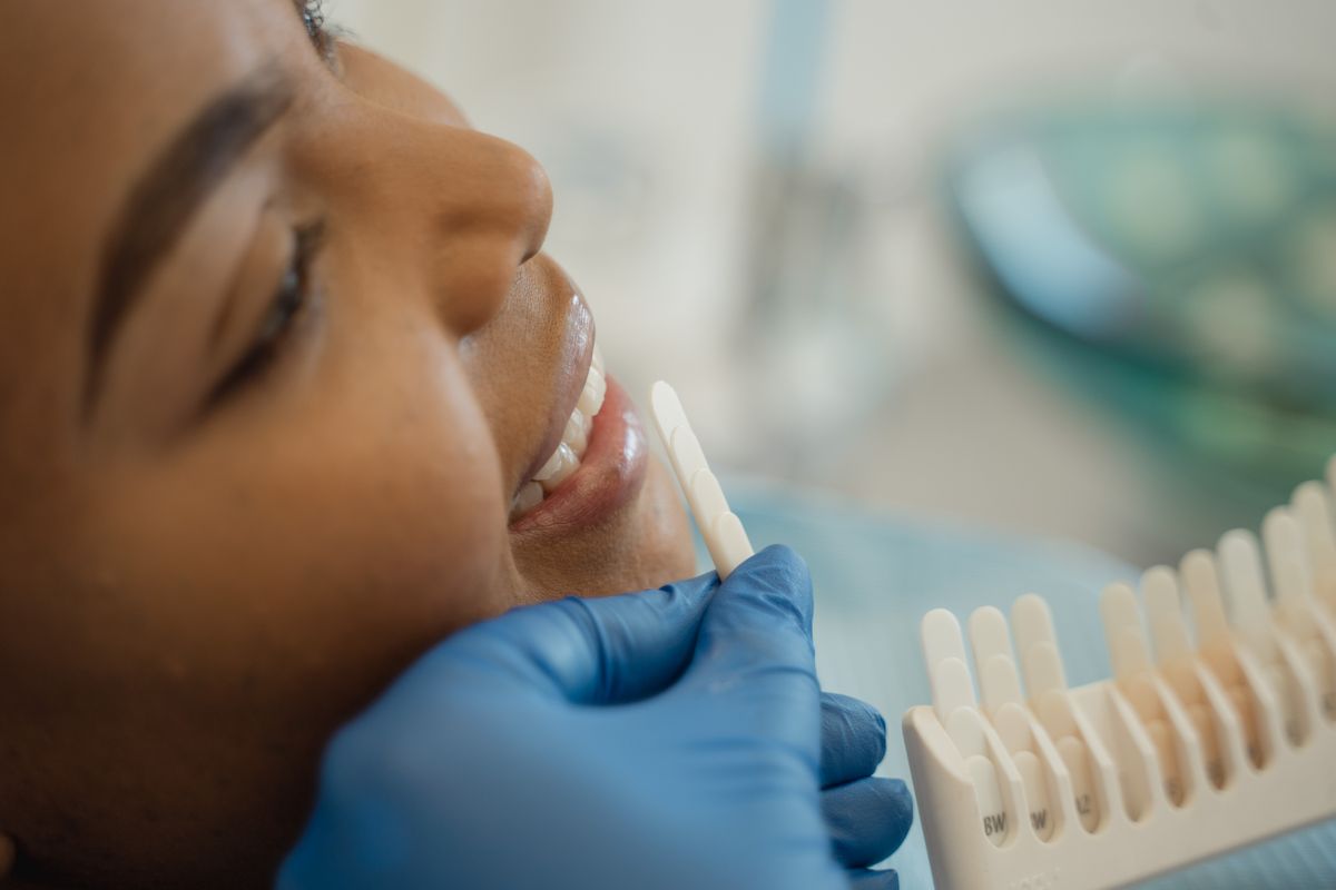 Illustrative close-up of a patient's confident smile during a consultation, not the actual clinic